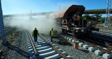Aerial view of construction workers on a train track Stock Footage