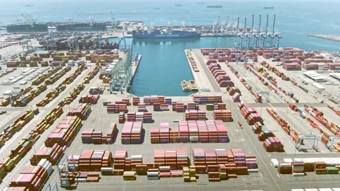 Aerial view of container loading in a cargo freight ship with industrial crane Stock Footage 163377093