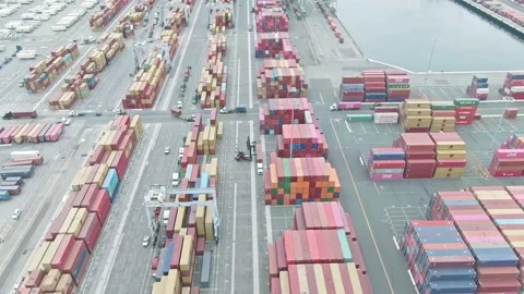 Aerial view of container loading in a cargo freight ship with industrial crane.  Video stock 164795498