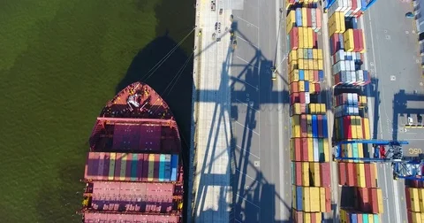 Aerial view of container ship anchored in the port and loaded with containers -4 Stock Footage 80518196