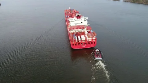 Aerial View of Container Ship and Tugboat Arriving Port of Philadelphia Stock Footage 74514034