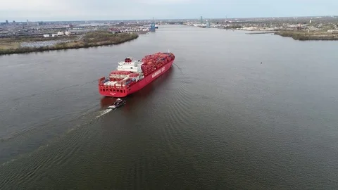 Aerial View of Container Ship and Tugboat Arriving Port of Philadelphia Stock Footage 74514201