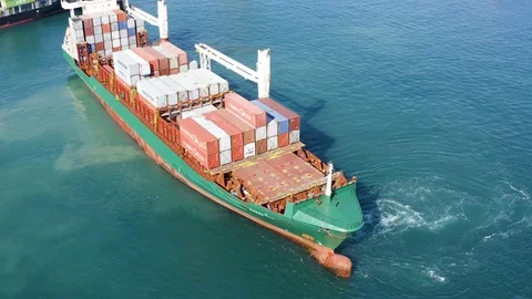 Aerial view of container ship AVERA maneuvering in the port of Alicante. Stock Footage 125433686