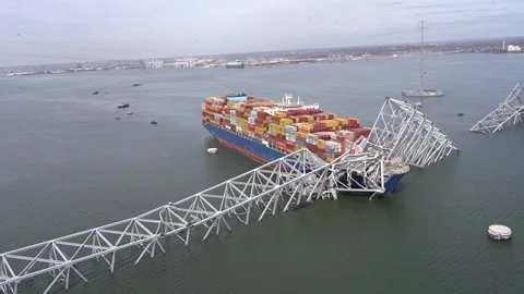 Aerial view of container ship 'Dali' lodged in collapsed Key Bridge, Baltimore Stock Footage 270530678