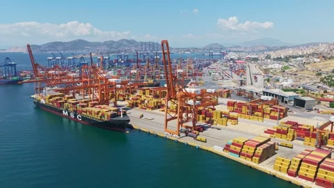 Aerial view of container ship docking at piraeus port terminal Stock Footage 338102469