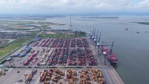 Aerial view of a container ship docking at a commercial port terminal Stock Footage 348088033