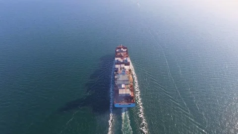 Aerial view of container ship floats in the ocean after loading in port of China Stock Footage 75459102