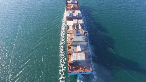 Aerial view of container ship floats in the ocean after loading in port of China Stock Footage 75459634