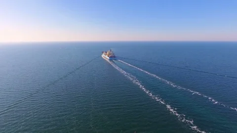 Aerial view of container ship floats in the ocean after loading in port of China Stock Footage 75460893