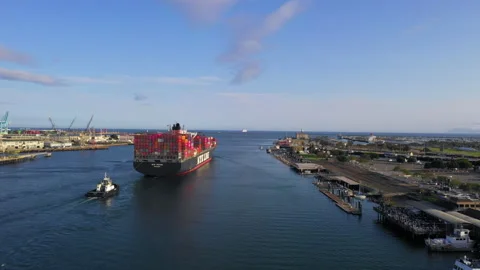 Aerial view of a container ship leaving the Port of Los Angeles Stock Footage 131015751