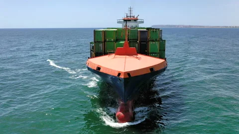 Aerial view of container ship maneuvering for enter in the port of Alicante. Stock Footage 142100349