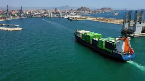 Aerial view of container ship maneuvering for enter in the port of Alicante. Stock Footage 142101669