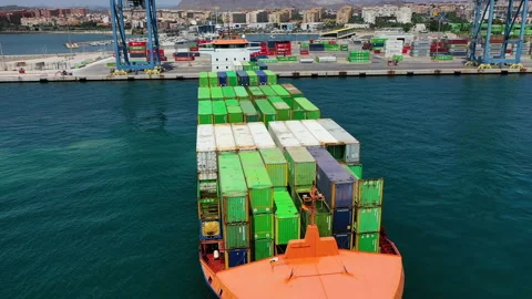 Aerial view of container ship maneuvering for enter in the port of Alicante. Stock Footage 142103342