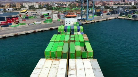 Aerial view of container ship maneuvering for enter in the port of Alicante. Stock Footage 142104534