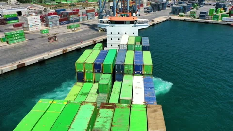 Aerial view of container ship maneuvering for enter in the port of Alicante. Stock Footage 142105065