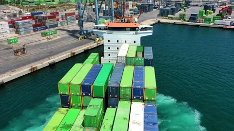 Aerial view of container ship maneuvering for enter in the port of Alicante. Stock Footage 142105104