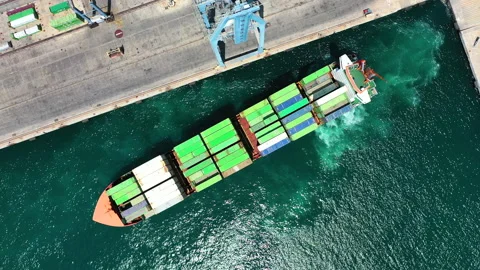 Aerial view of container ship maneuvering for enter in the port of Alicante. Stock Footage 142105849