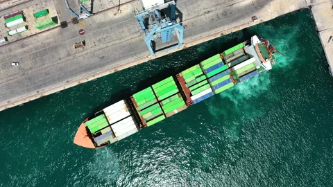 Aerial view of container ship maneuvering for enter in the port of Alicante. Stock Footage 142105876