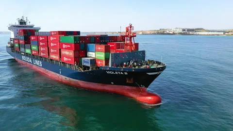 Aerial view of container ship maneuvering for enter in the port of Alicante. Stock Footage 166356320