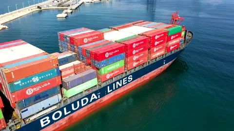 Aerial view of container ship maneuvering for enter in the port of Alicante. Stock Footage 166357498