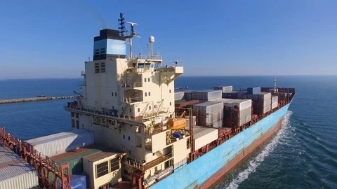 Aerial view of container ship passes through the channel goes into the ocean. Stock Footage 75456861