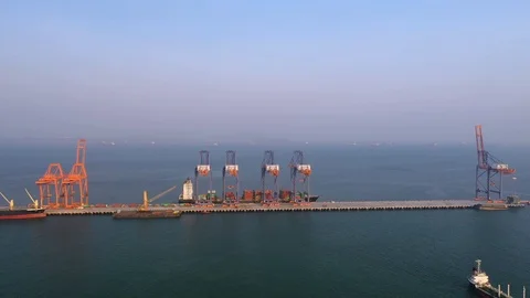 Aerial view. Container ship in pier with crane bridge carries out export and imp 스톡 동영상 105356600