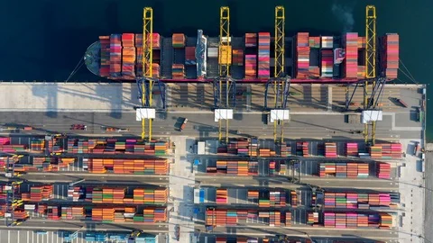 Aerial view. Container ship in pier with crane bridge carries out export and imp Видео 106670667
