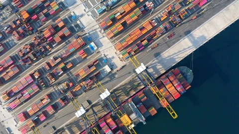 Aerial view. Container ship in pier with crane bridge carries out export and imp Stock-Footage 107095263