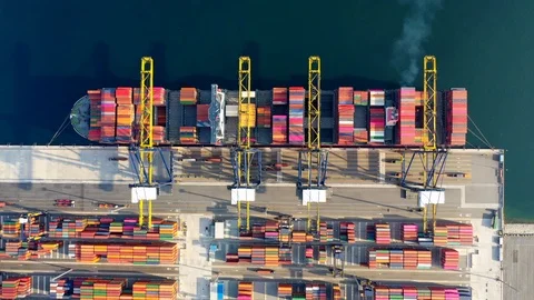 Aerial view. Container ship in pier with crane bridge carries out export and imp Video stock 107249574