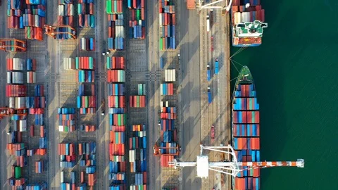 Aerial view. Container ship in pier with crane bridge carries out export Stock Footage 112613817