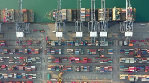 Aerial view. Container ship in pier with crane bridge Stock-Footage 123988629