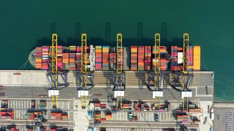 Aerial view. Container ship in pier with crane bridge carries out export  Stock Footage 127425915