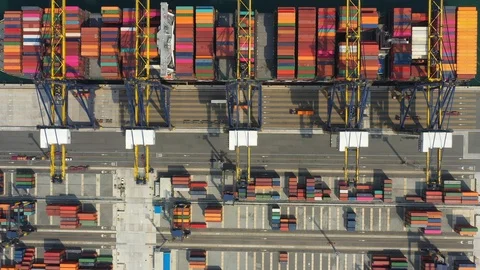 Aerial view. Container ship in pier with crane bridge carries out export  Stock Footage 127426046