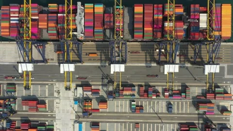 Aerial view. Container ship in pier with crane bridge carries out export  Stock Footage 130656076