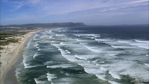 Aerial view of container ship sailing in sea, Empty beach and waves Stock Footage 109438292