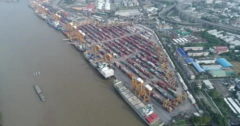 Aerial view container ship terminal unloading crane of cargo ship terminal Stock Footage 134975987