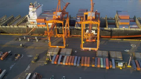 Aerial view Container Ship unloading freight Port of Seattle Stock Footage