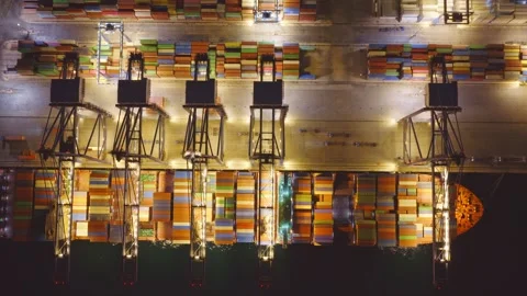 Aerial view of container ship unloading at night port Stockbeeldmateriaal 336755112