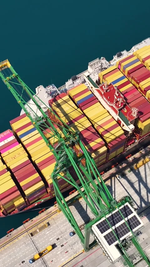 Aerial view of container terminal with cargo ship and shipping containers Stock Footage 340234579