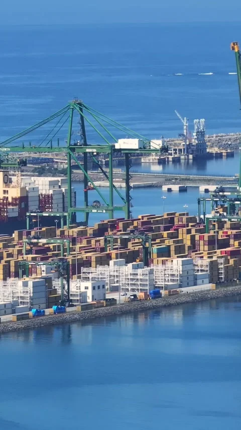 Aerial view of container terminal with cargo ship and shipping containers Stock Footage 340235215