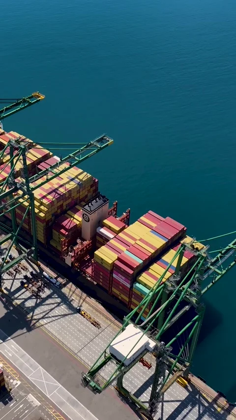 Aerial view of container terminal with cargo ship and shipping containers Stock Footage 340235386