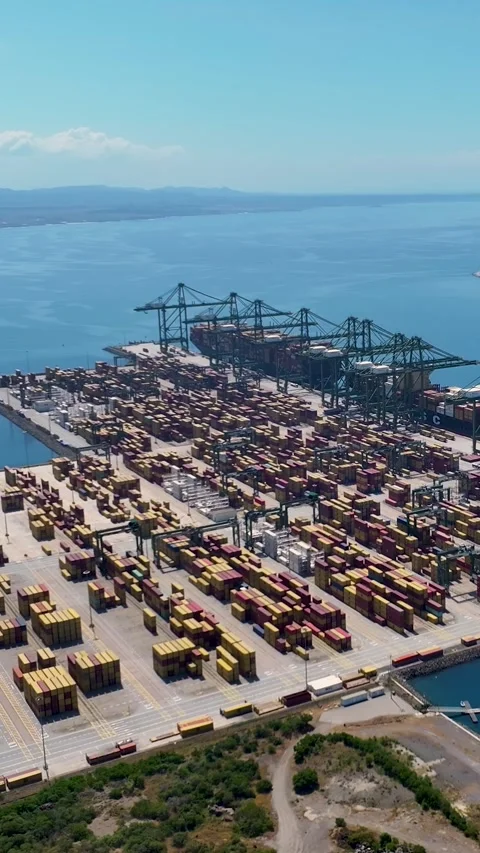 Aerial view of container terminal with cargo ships and shipping containers Video stock 342321548