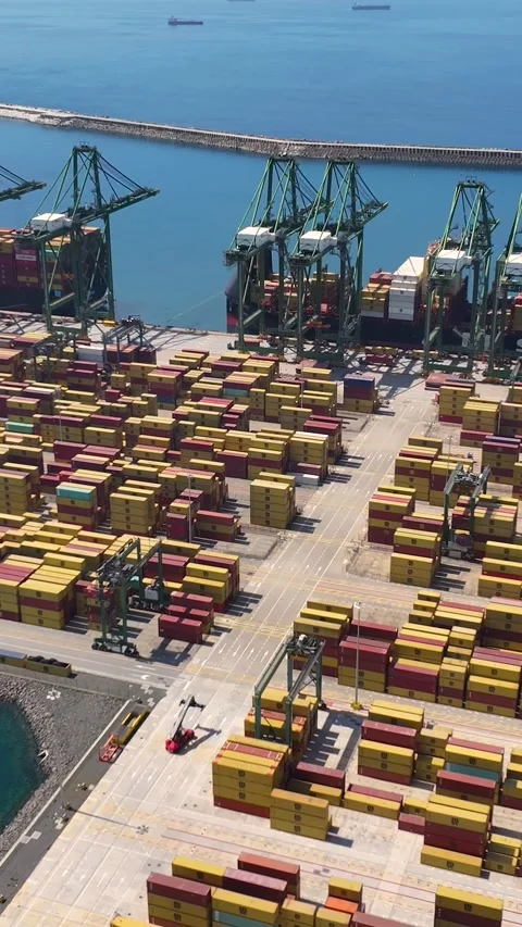 Aerial view of container terminal operations with shipping containers and cargo Video stock 340235083