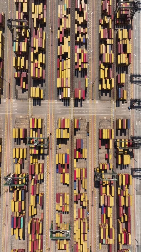 Aerial view of container terminal with shipping containers and cargo vehicles Video stock 341837959