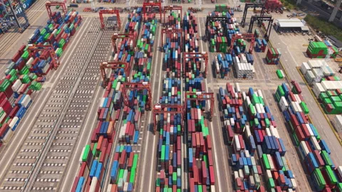 Aerial view of container yard with cranes at shipping terminal Stock Footage 346889877