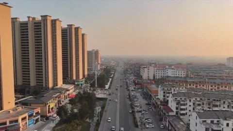 Aerial view of the contrast between modern high-rises and old housing in a s Stock Footage 325209396