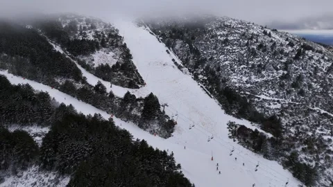 Aerial view of converging ski slopes with skiers, La Pinilla, Spain Stock Footage 339373232