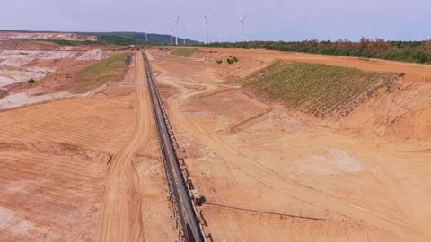 Aerial view of conveyor belt system in an open pit mine Stock Footage 342813698