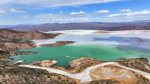 Aerial view of copper mine and hills under cloudy sky, United States. Stock Footage 312840374
