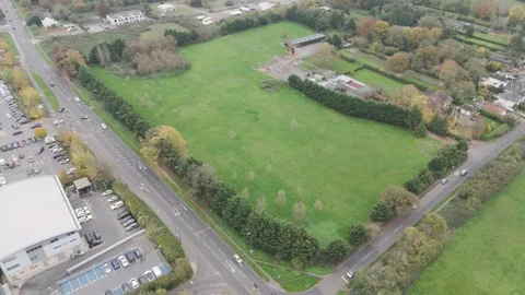 Aerial view of a corner plot of green field land in Berkshire, prepared for Vídeos de archivo 294177368